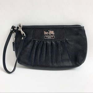 Black pleated coach hand and wrist bag